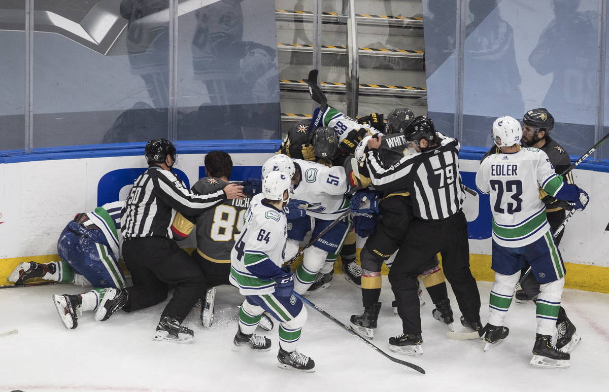 Vegas Golden Knights and Vancouver Canucks rough it up during the third period of Game 2 of an ...
