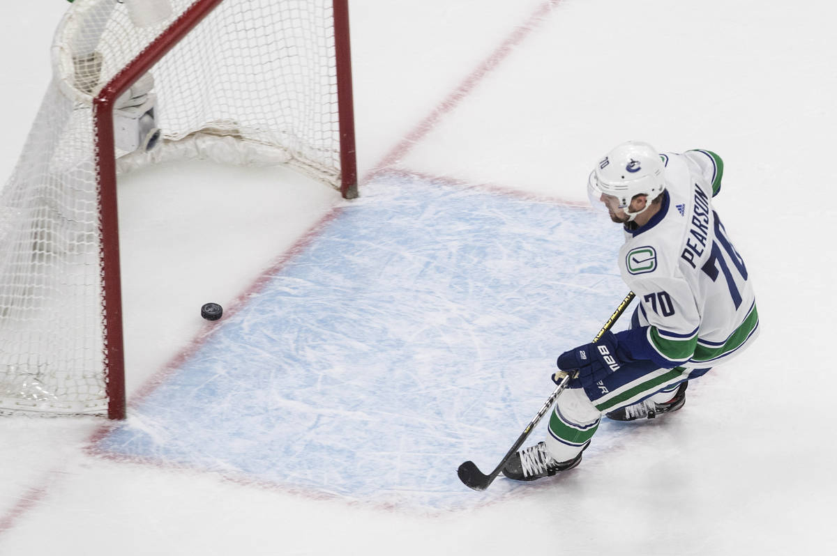 Vancouver Canucks' Tanner Pearson (70) scores an empty-net goal against the Vegas Golden Knight ...