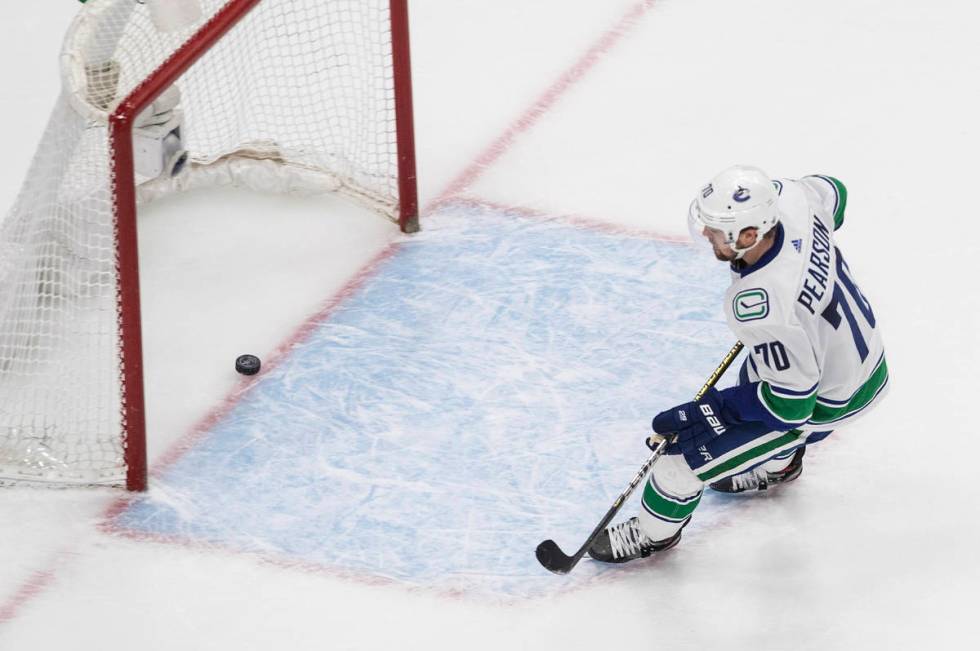 Vancouver Canucks' Tanner Pearson (70) scores an empty-net goal against the Vegas Golden Knight ...