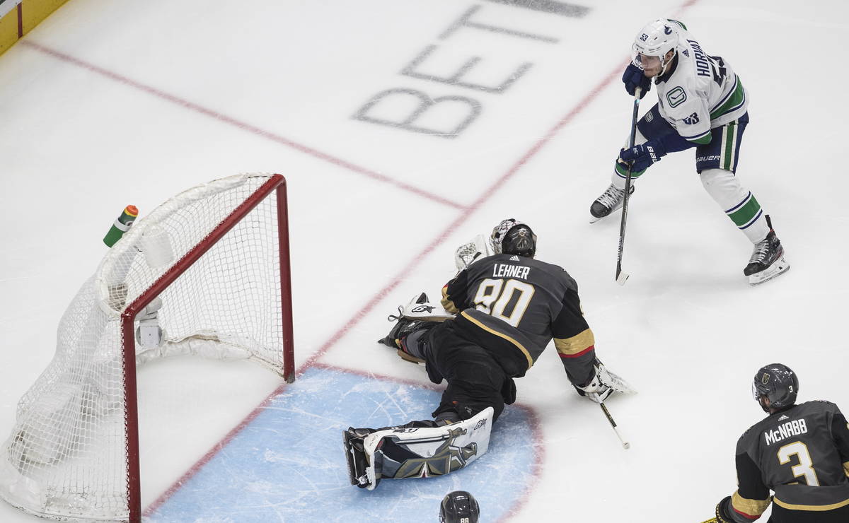 Vegas Golden Knights goalie Robin Lehner (90) gives up a goal to Vancouver Canucks' Bo Horvat ( ...