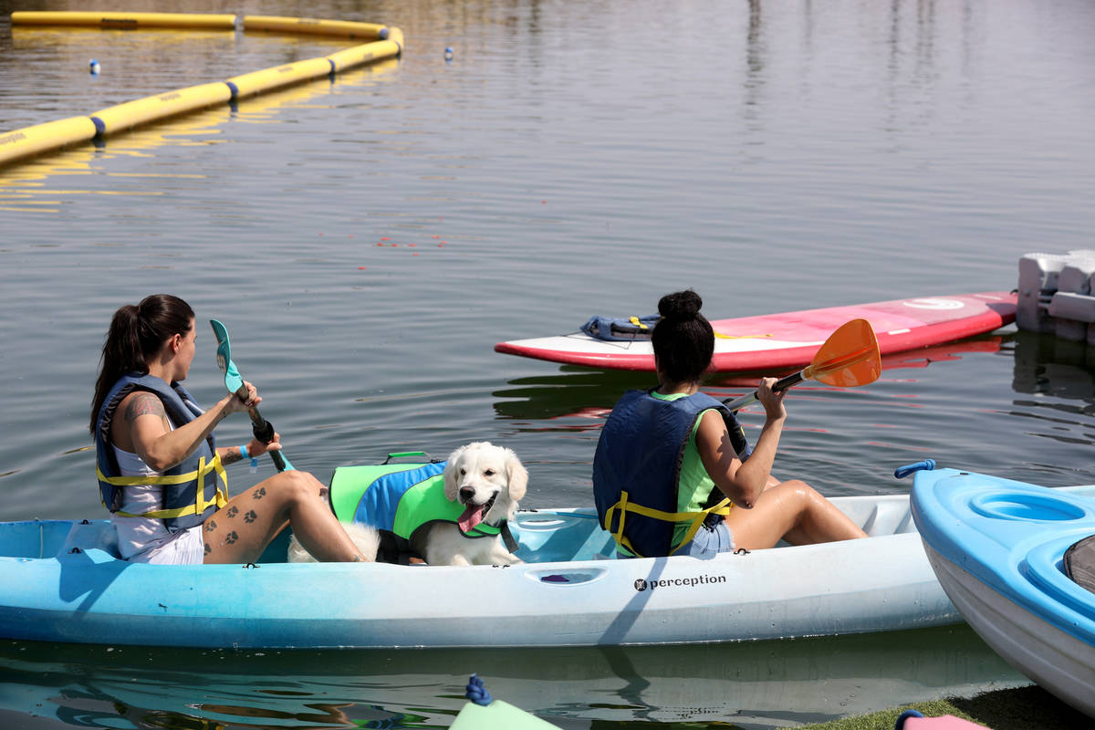 Ashley, left, and Natasha Rupe of Las Vegas kayak with their dog, Steve, during Bring Your Dog ...