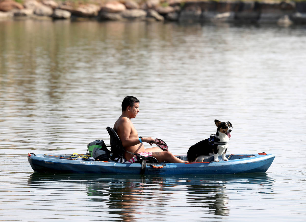Carlos Portillo of Las Vegas kayaks with Devon Anthony during Bring Your Dog to the Lake Day at ...