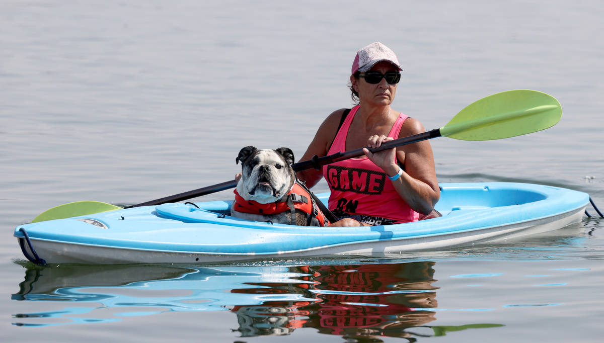 Kimberly Jones of Las Vegas kayaks with Brutus during Bring Your Dog to the Lake Day at Lake La ...