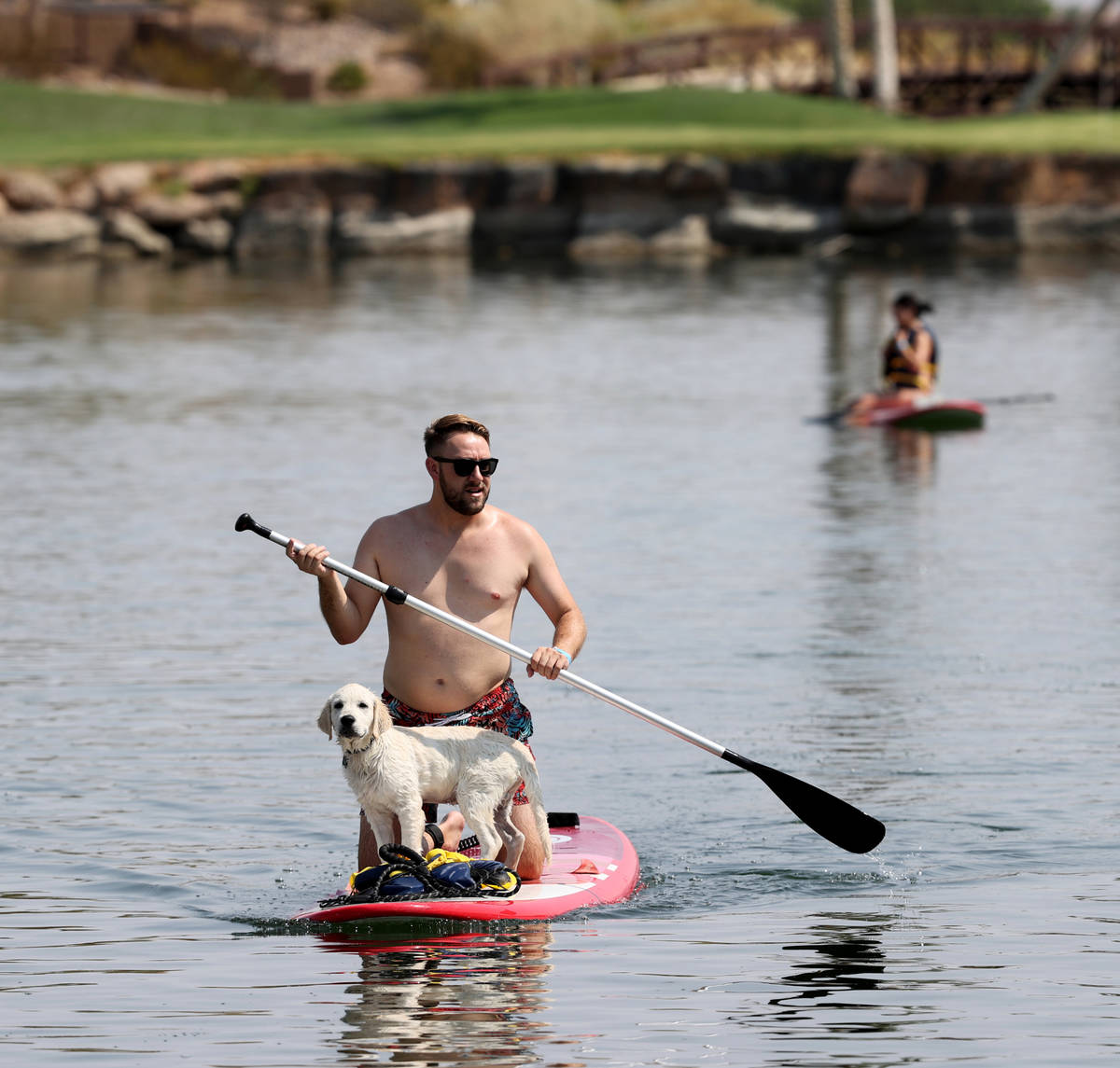 Patrick Kawka of Las Vegas paddleboards with his dog, Zuko, during Bring Your Dog to the Lake D ...