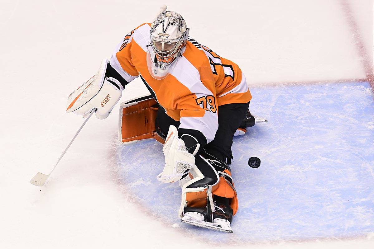 Philadelphia Flyers goaltender Carter Hart (79) fails to stop the puck on a shot from New York ...