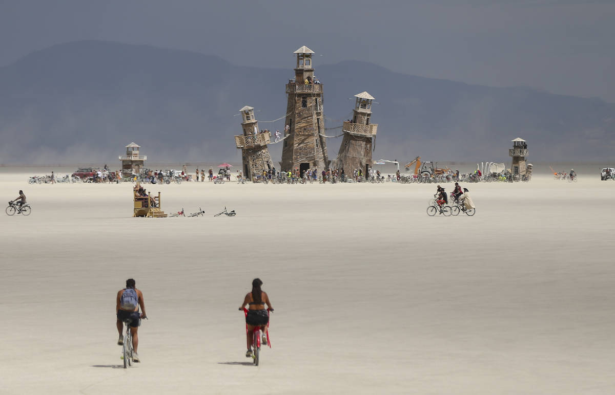 The Black Rock Lighthouse Service installation is shown in the distance during Burning Man at t ...