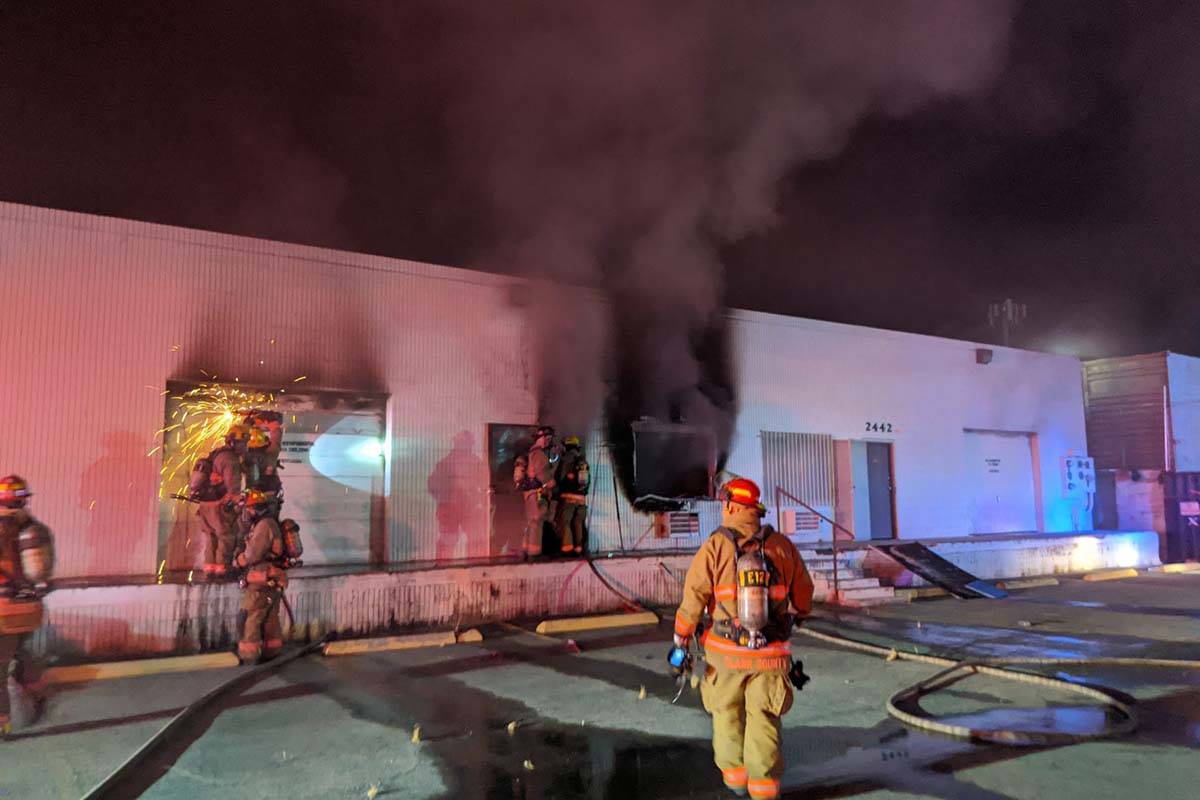 Las Vegas firefighters battle a fire in an industrial building at 2458 Industrial Road early We ...