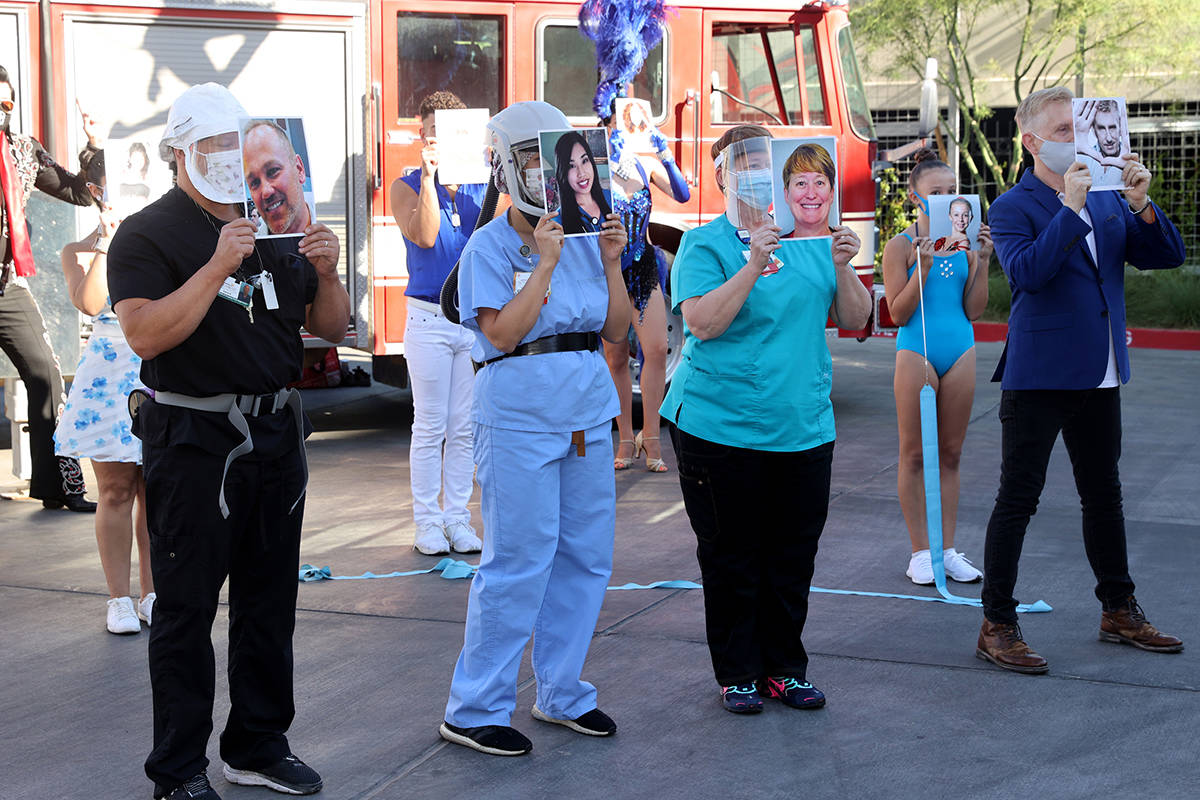 Entertainers and medical professionals, including from left, Aaron Huttenlocker, team superviso ...