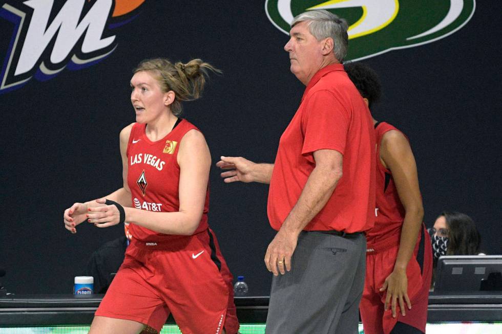 Las Vegas Aces head coach Bill Laimbeer sends center Carolyn Swords, left, into the game during ...