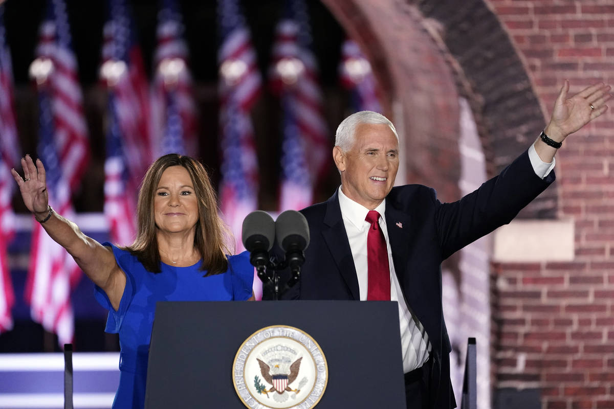 Vice President Mike Pence arrives with his wife Karen Pence to speak on the third day of the Re ...