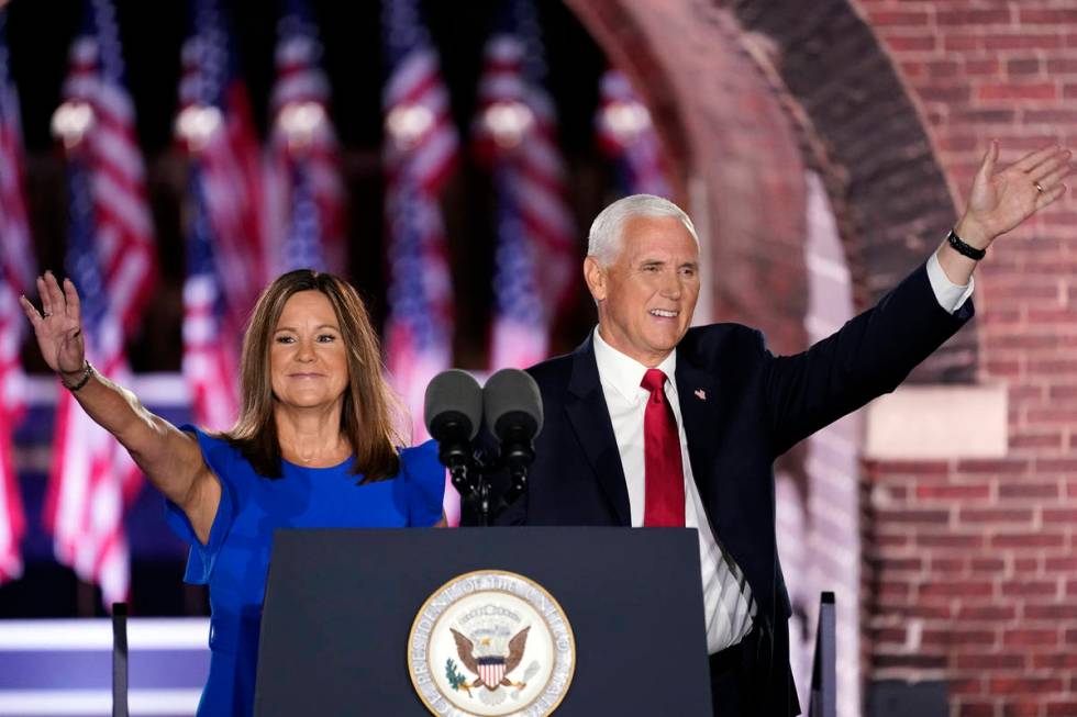 Vice President Mike Pence arrives with his wife Karen Pence to speak on the third day of the Re ...