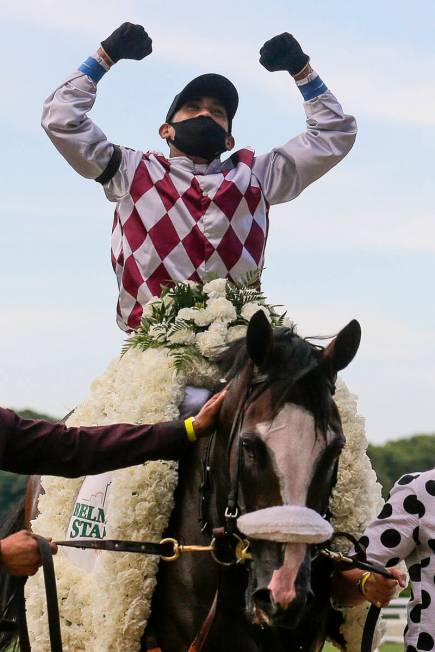 Jockey Manny Franco reacts after winning the 152nd running of the Belmont Stakes horse race wit ...