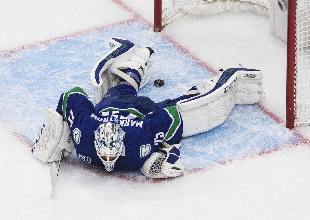 Vancouver Canucks goalie Jacob Markstrom (25) is scored on by the Vegas Golden Knights during t ...