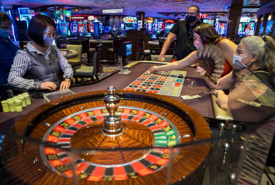 (From left) Roulette croupier Umee Mercado looks on as players Ted, Stepheni and Estrella Steel ...