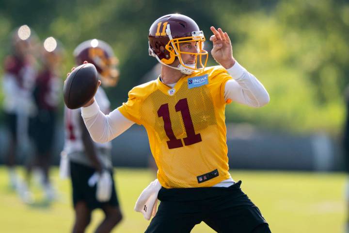 Washington quarterback Alex Smith (11) throws the ball during practice at the team's NFL footba ...