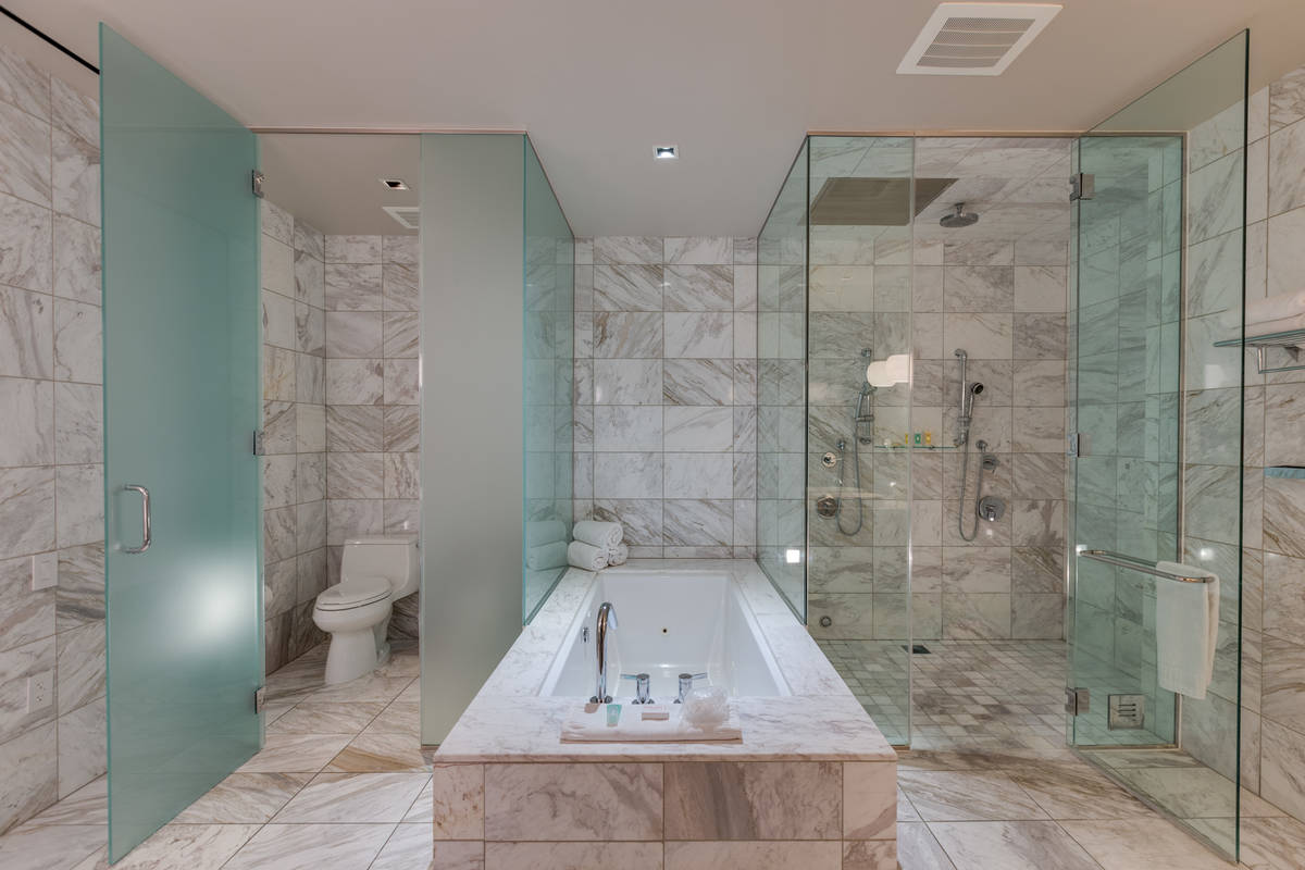 The spa-like main master bath features a walk-in steam shower. It also has a Jacuzzi tubs, doub ...