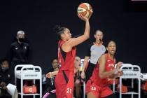 Las Vegas Aces guard Kayla McBride (21) goes up for a shot in front of Dallas Wings guard Marin ...