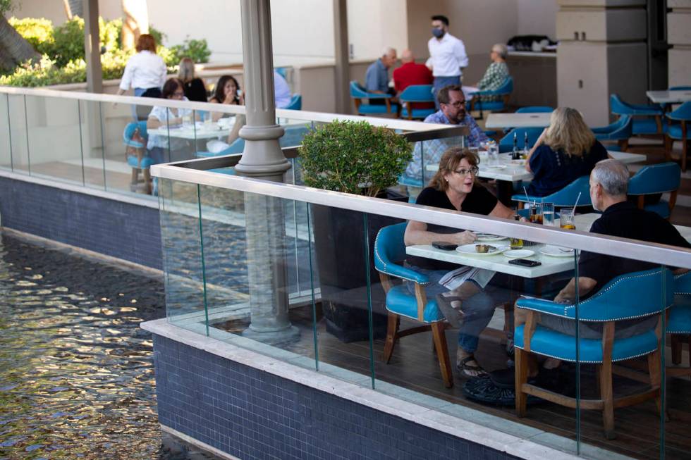 Colleen Diliberto speaks to her husband Michael Diliberto while eating dinner on the patio at O ...