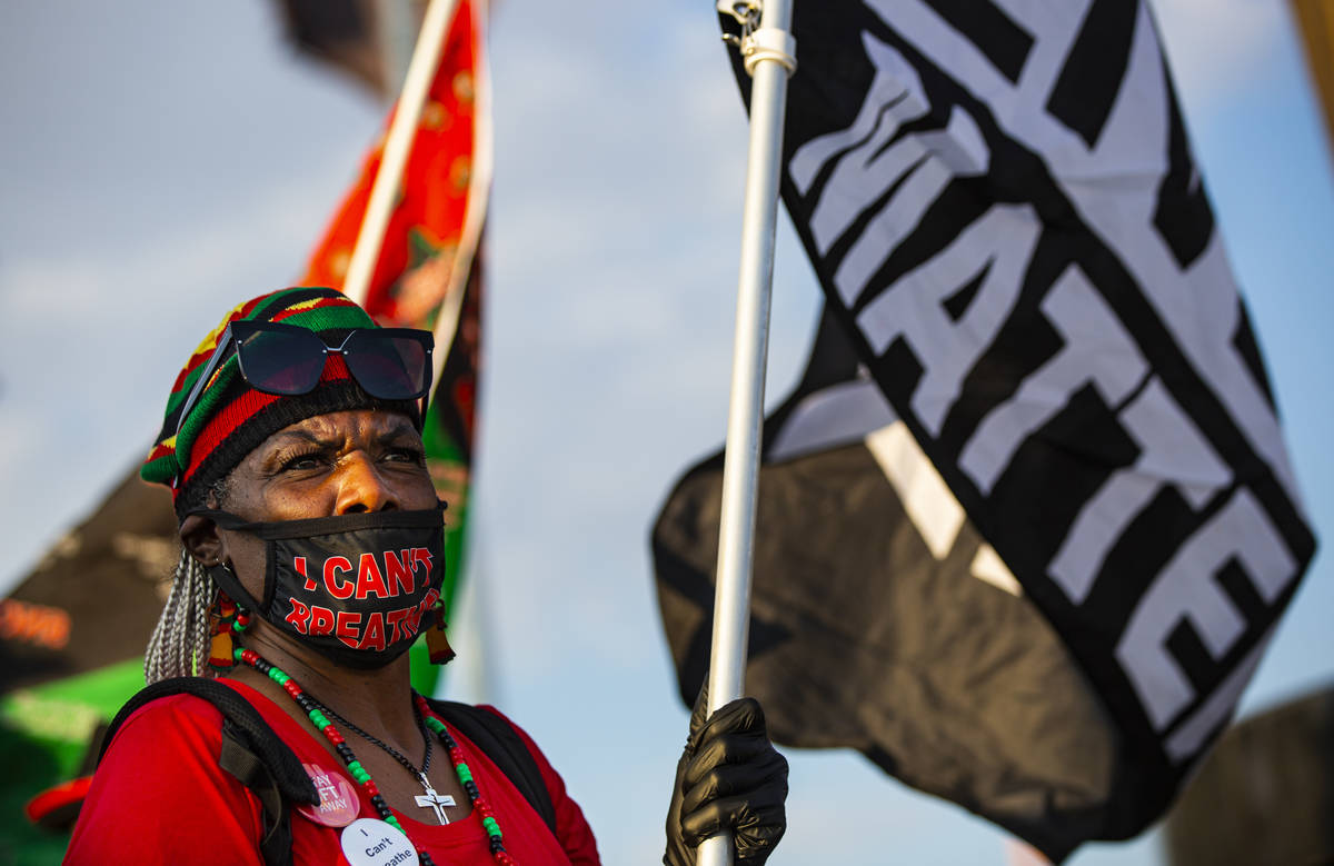 Yvonne Wesley, of Las Vegas, holds a Black Lives Matter flag during a rally against police brut ...