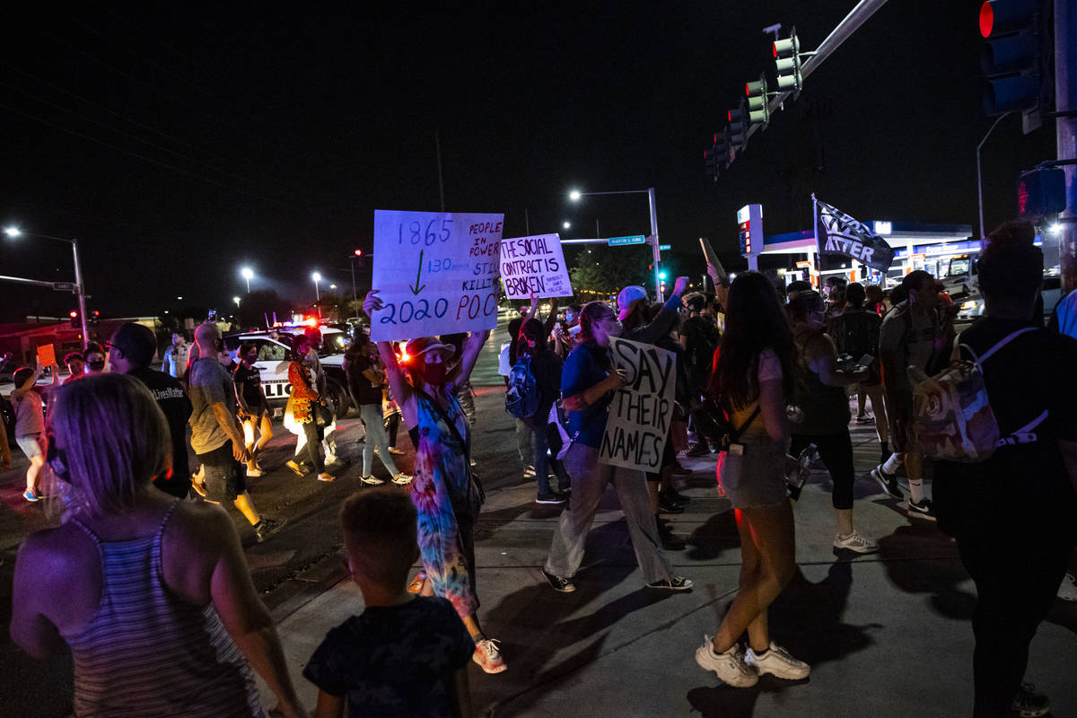 Protesters return to the sidewalk after stopping traffic during a rally against police brutalit ...