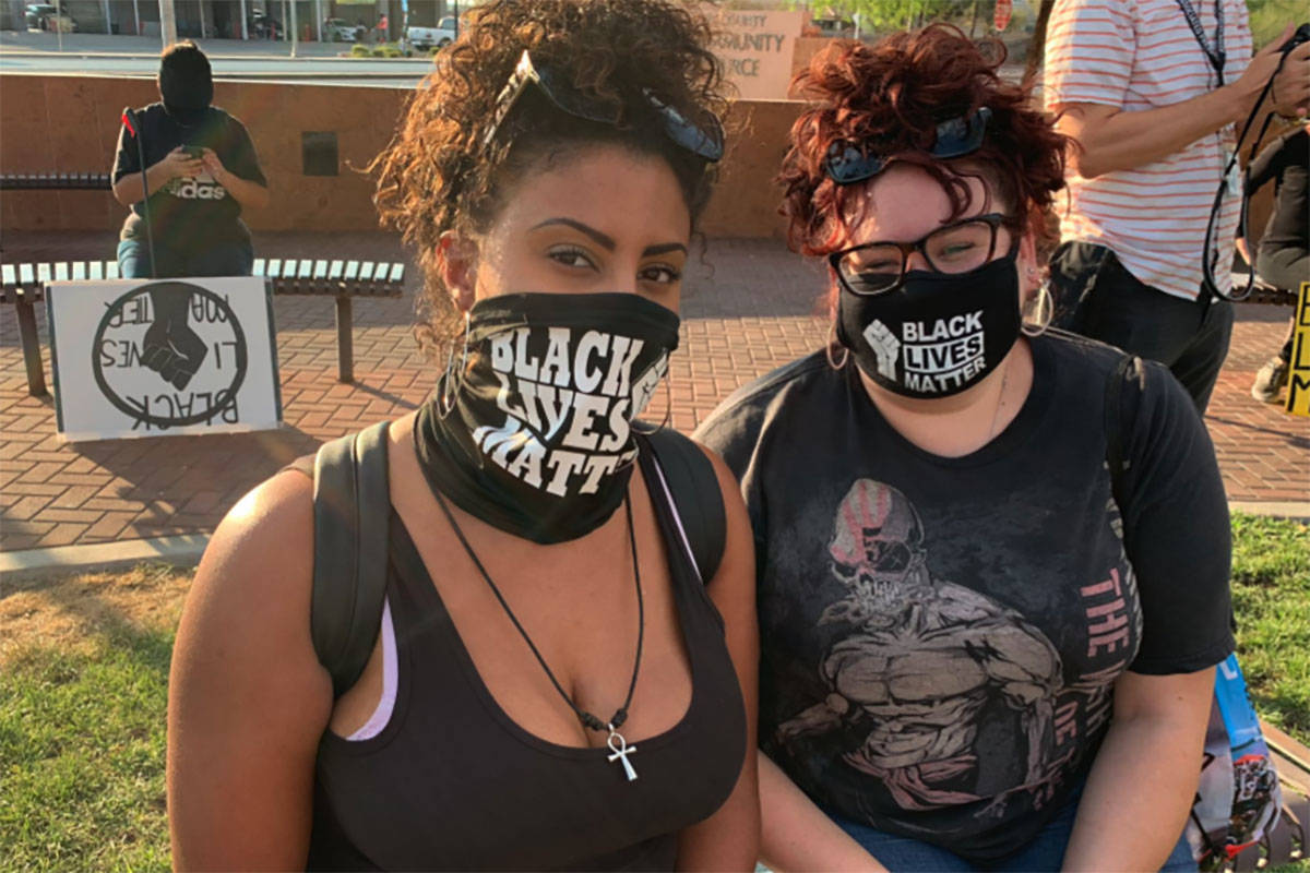 Las Vegas residents Sierra McDaniel and Samantha Archuleta take part in a rally and protest in ...