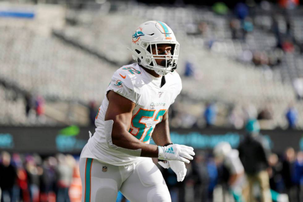 Miami Dolphins middle linebacker Raekwon McMillan (52) warms up before an NFL football game aga ...