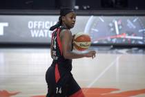 Las Vegas Aces guard Sugar Rodgers (14) brings the ball up the court during the first half of a ...