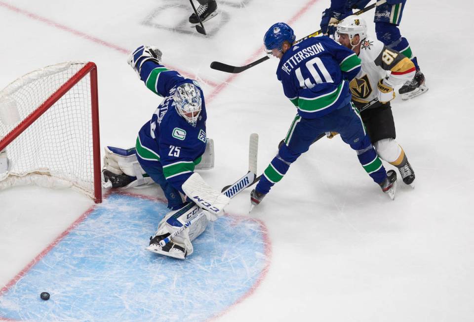 Vegas Golden Knights' Jonathan Marchessault (81) is stopped by Vancouver Canucks goalie Jacob M ...