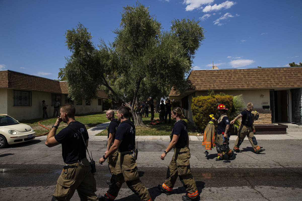 Clark County firefighters respond to the scene of a residential fire that left one dead near Sa ...