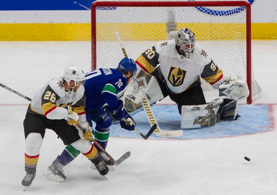 Vegas Golden Knights goalie Robin Lehner (90) makes the save on Vancouver Canucks' Tanner Pears ...