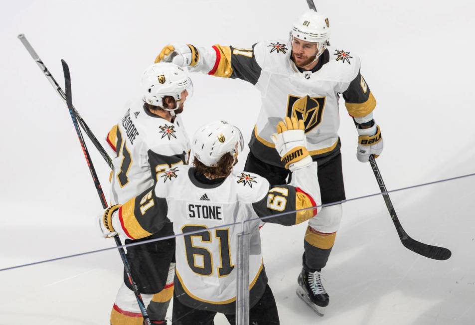 Vegas Golden Knights right wing Mark Stone (61) celebrates his goal against the Vancouver Canuc ...