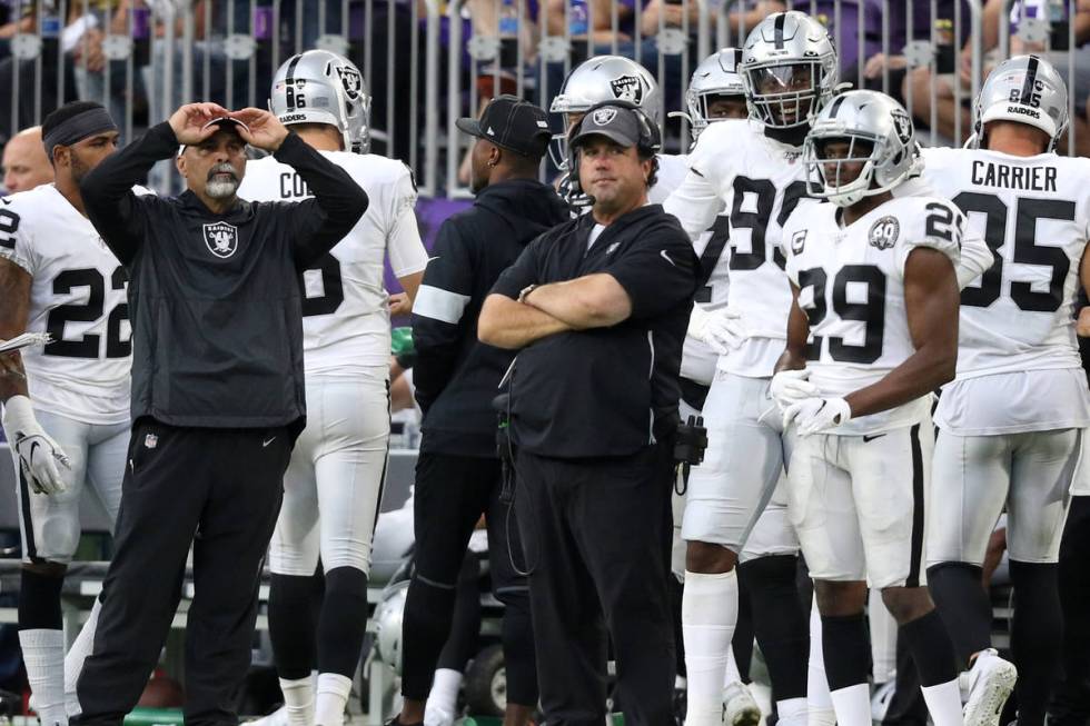 Oakland Raiders special teams coordinator Rich Bisaccia grabs his hat as defensive coordinator ...