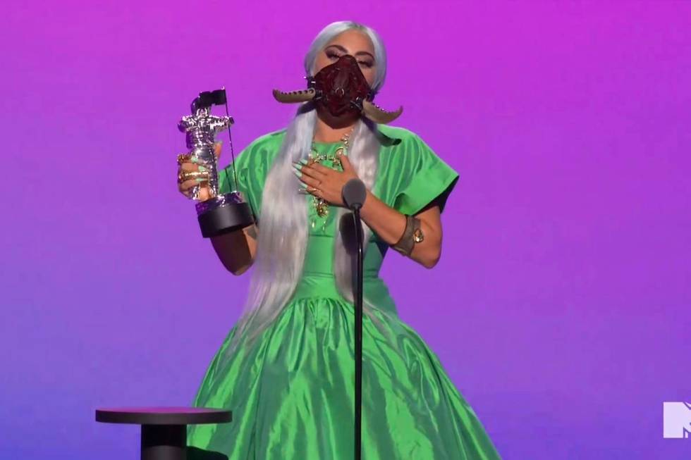 In this video grab issued Sunday, Aug. 30, 2020, by MTV, Lady Gaga accepts the award for song o ...