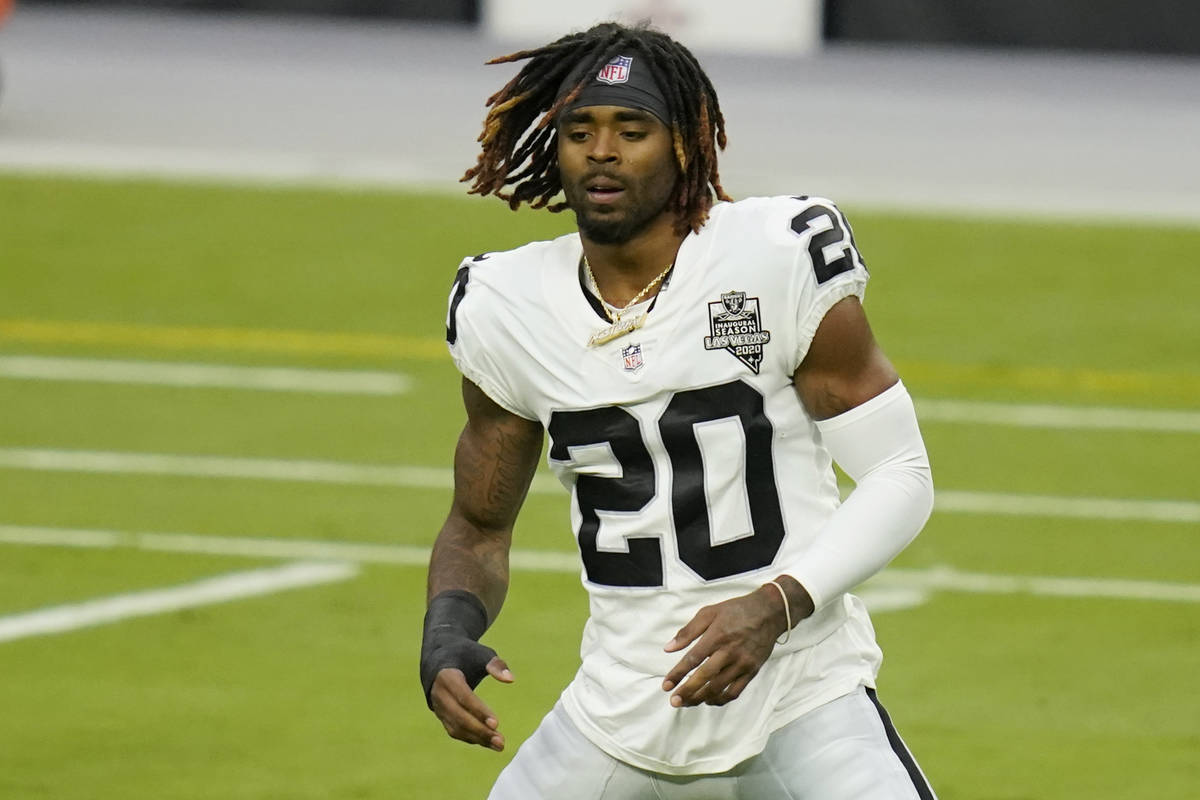 Las Vegas Raiders cornerback Damon Arnette (20) stretches during an NFL football training camp ...