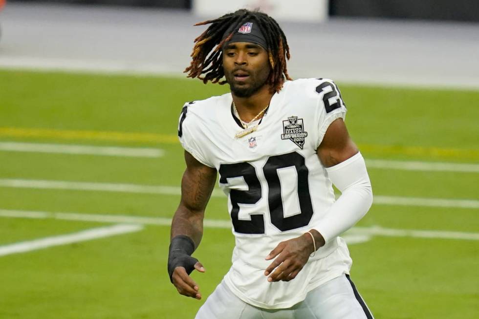 Las Vegas Raiders cornerback Damon Arnette (20) stretches during an NFL football training camp ...