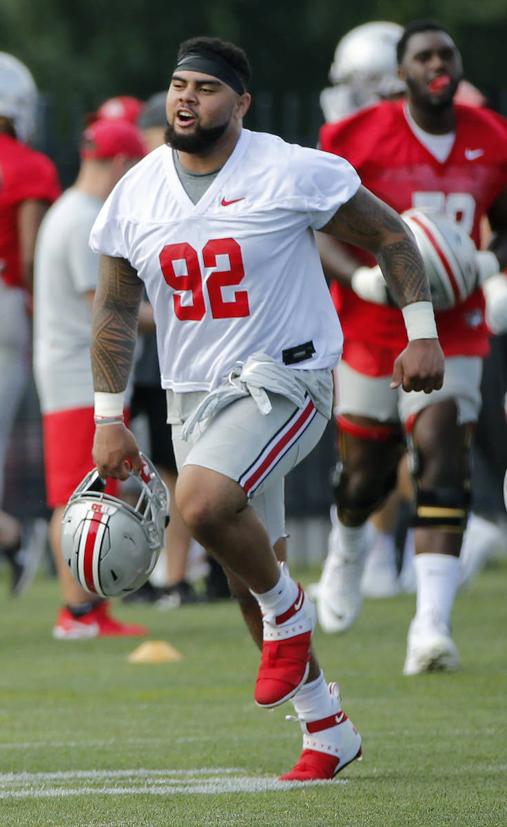 Ohio State Buckeyes defensive tackle defensive tackle Haskell Garrett runs across the field dur ...