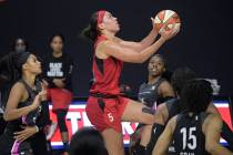 Las Vegas Aces forward Dearica Hamby goes up for a shot during the first half of the team's WNB ...