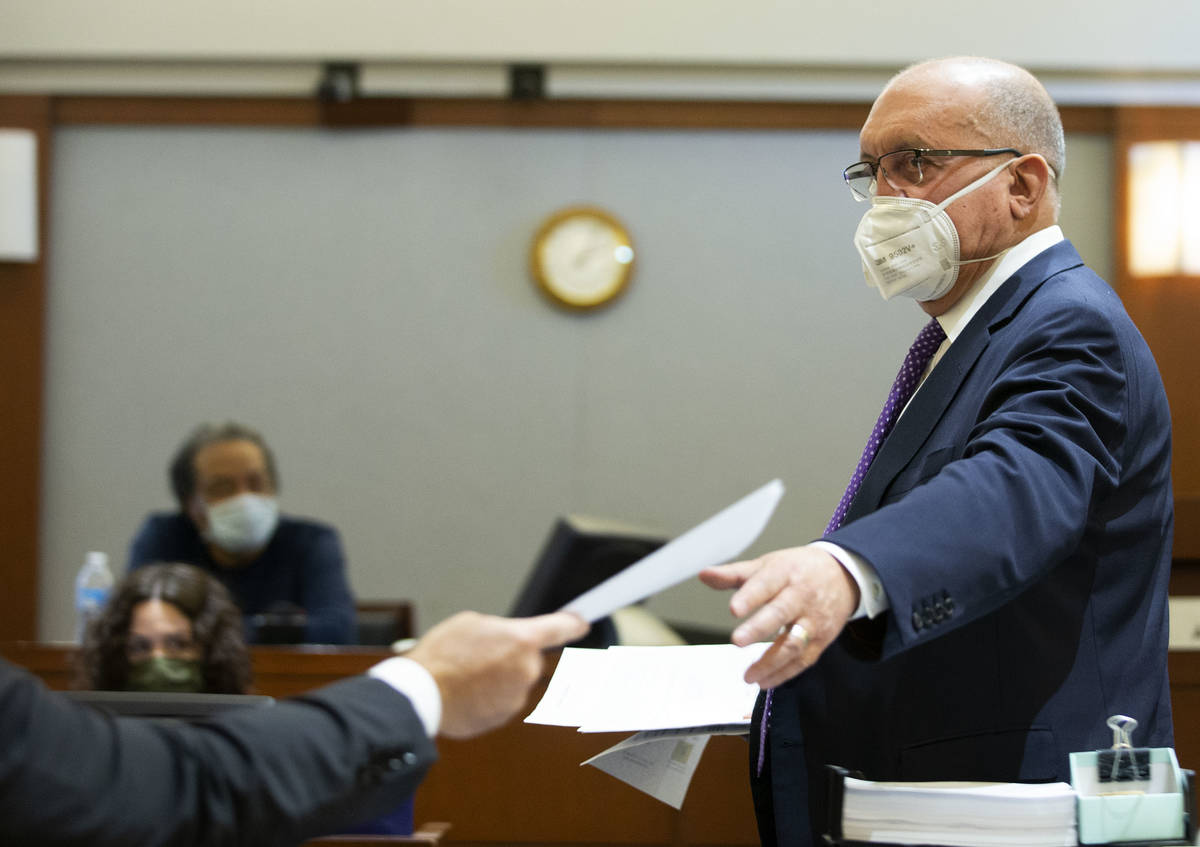 Attorney Dominic Gentile, who is defending Adolfo Orozco in the Alpine fire case, exchanges pap ...