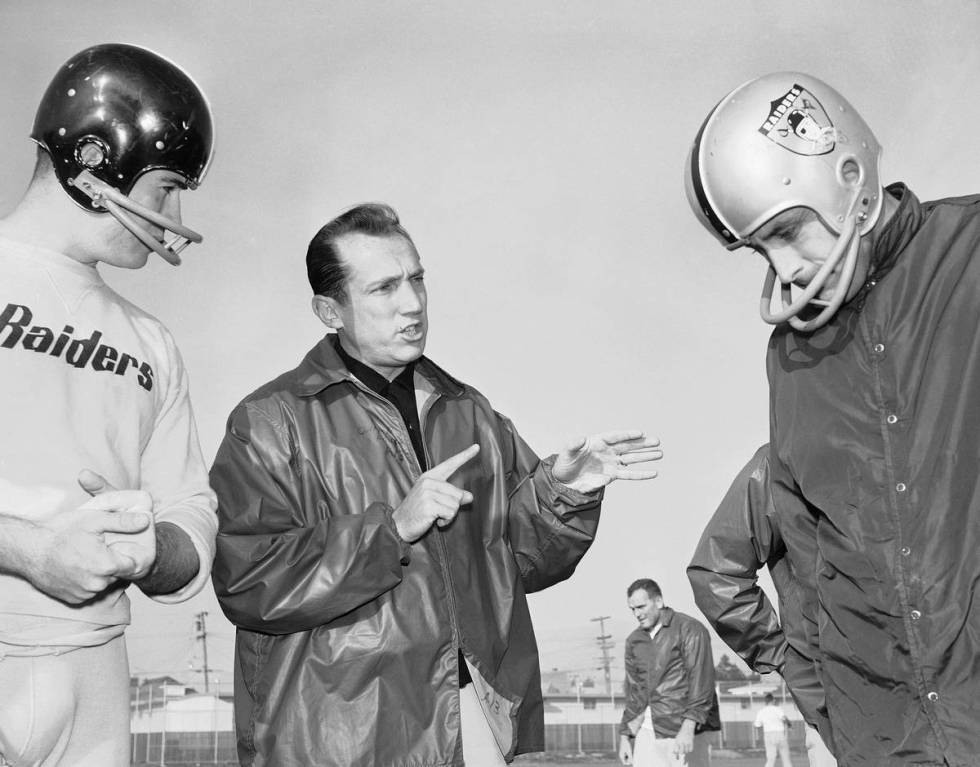 Raiders coach Al Davis talks with players during a practice in 1963 in Oakland. (The Associated ...