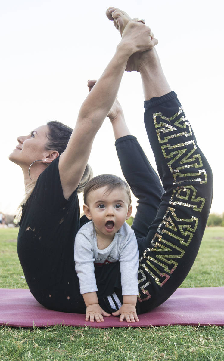 Luba Kazantseva stretches with her son Theodoros at Sunset Park in June. (Benjamin Hager/Las Ve ...
