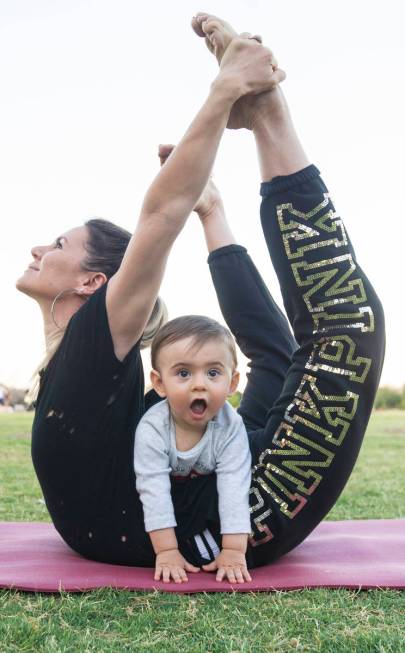 Luba Kazantseva stretches with her son Theodoros at Sunset Park in June. (Benjamin Hager/Las Ve ...