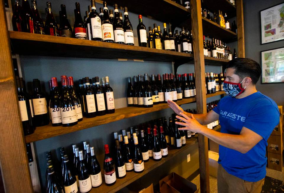 Mario Enriquez, co-founder of Garagiste Wine Room & Merchant, talks about wines at his business ...