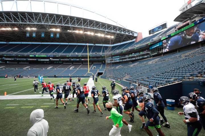 The Seattle Seahawks take to an empty CenturyLink Field for the NFL football team's scrimmage S ...