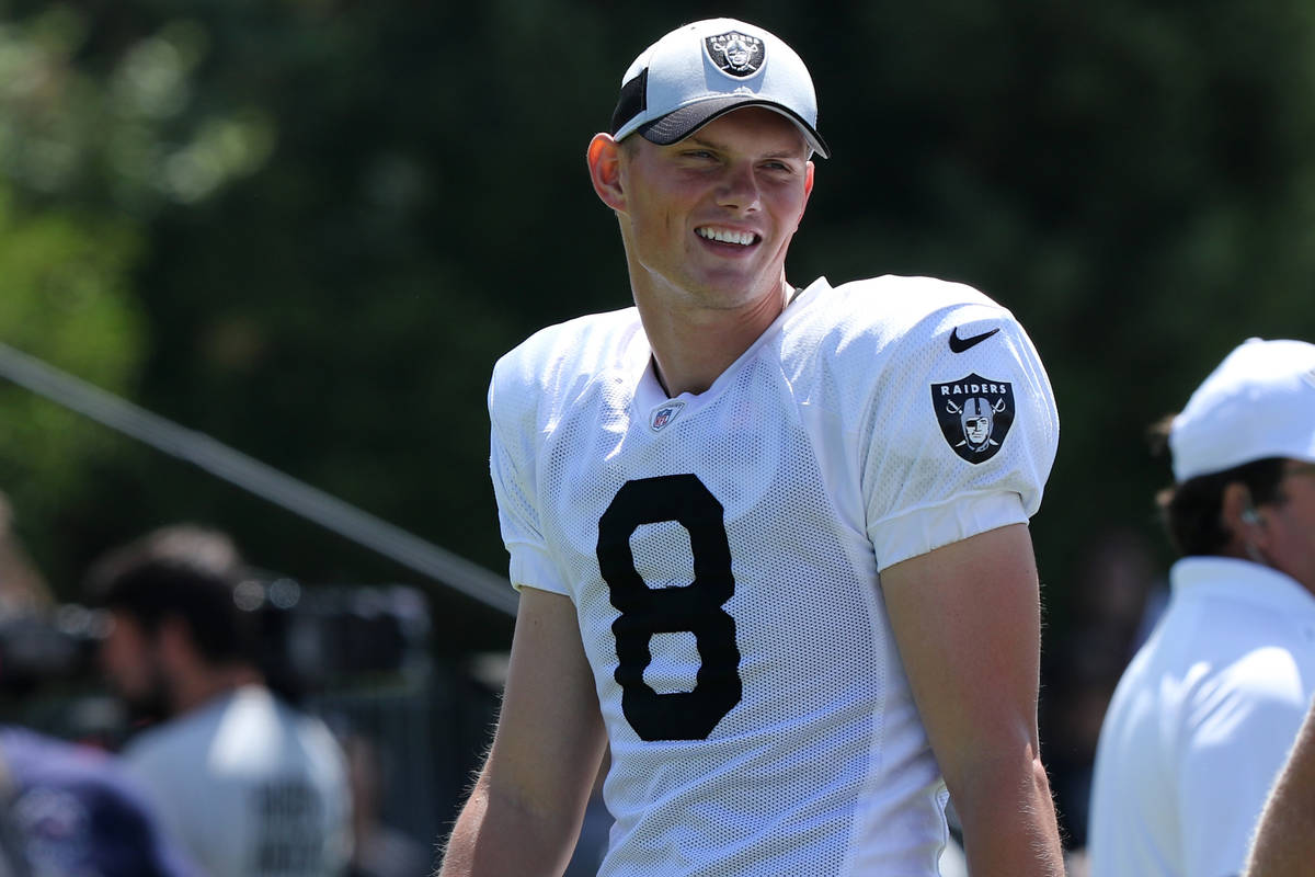 Oakland Raiders kicker Daniel Carlson (8) talks with long snapper Trent Sieg (47) during the NF ...