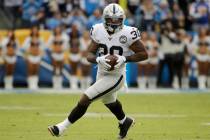 Oakland Raiders running back Jalen Richard runs against the Los Angeles Chargers during the fir ...