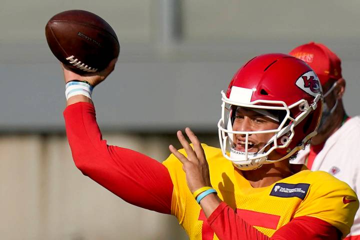 Kansas City Chiefs quarterback Patrick Mahomes passes during an NFL football training camp prac ...