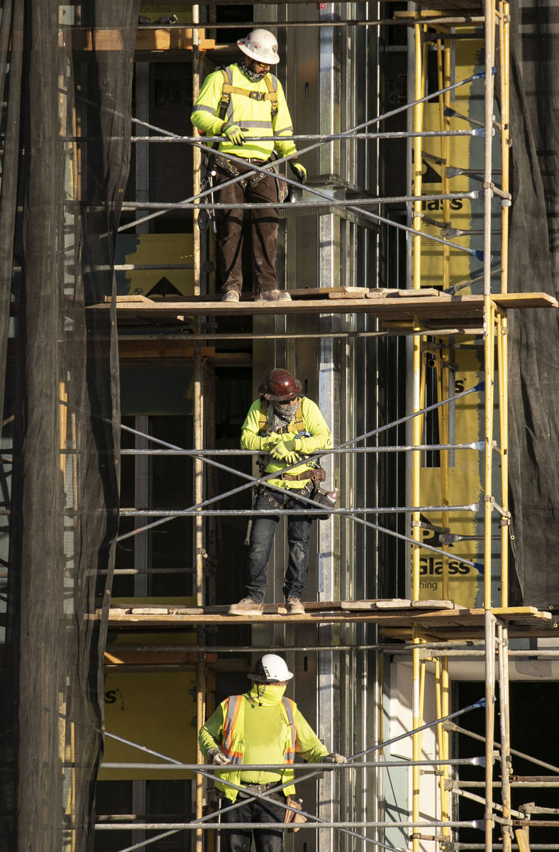 Construction workers are seen at the Resorts World construction site, on Monday, Aug. 31, 2020, ...