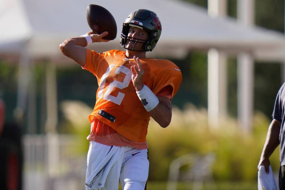 Tampa Bay Buccaneers quarterback Tom Brady (12) throws a pass during an NFL football training c ...