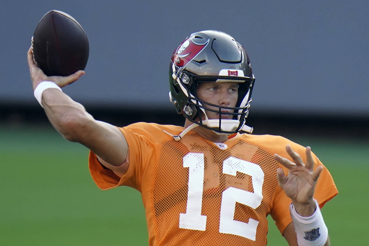 Tampa Bay Buccaneers quarterback Tom Brady (12) throws a pass during an NFL football training c ...