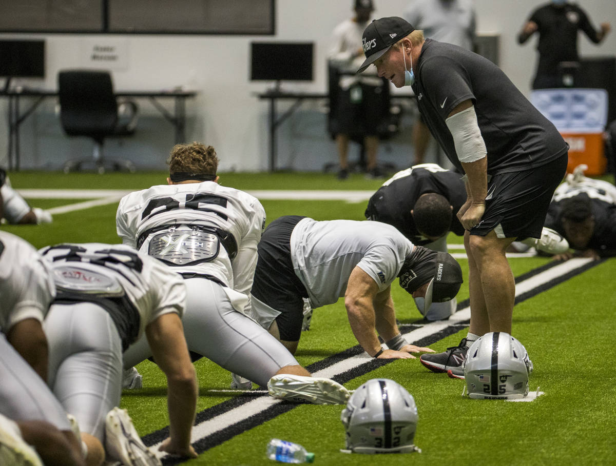 Las Vegas Raiders head coach Jon Gruden, right, talks with Las Vegas Raiders safety Erik Harris ...